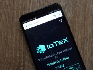 IOTX logo on a mobile phone screen