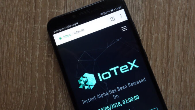 IOTX logo on a mobile phone screen