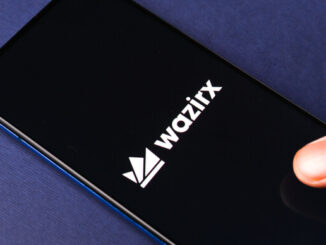 The WazirX logo on a phone